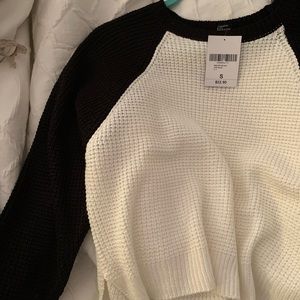 White and black sweater